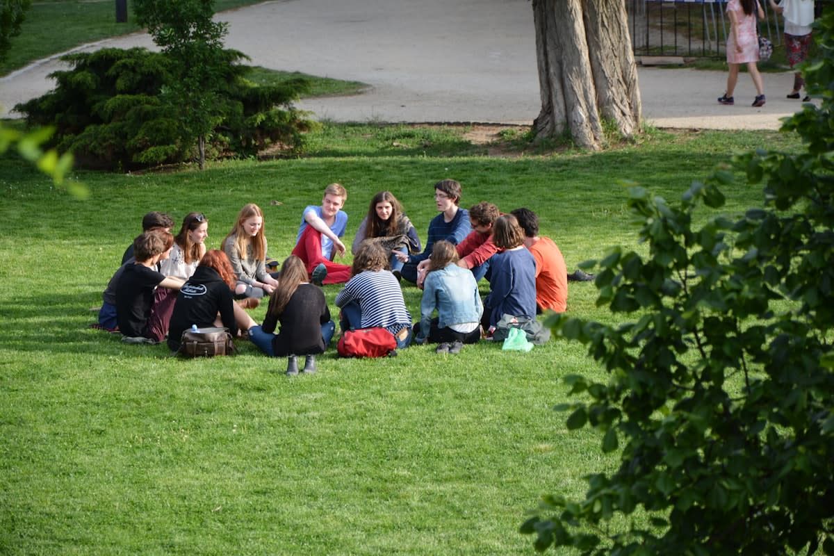 People sitting in a circle for a group discussion