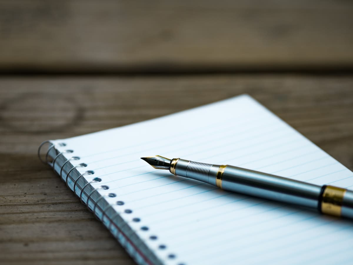 Close up of a high-end analog notebook and a fountain pen