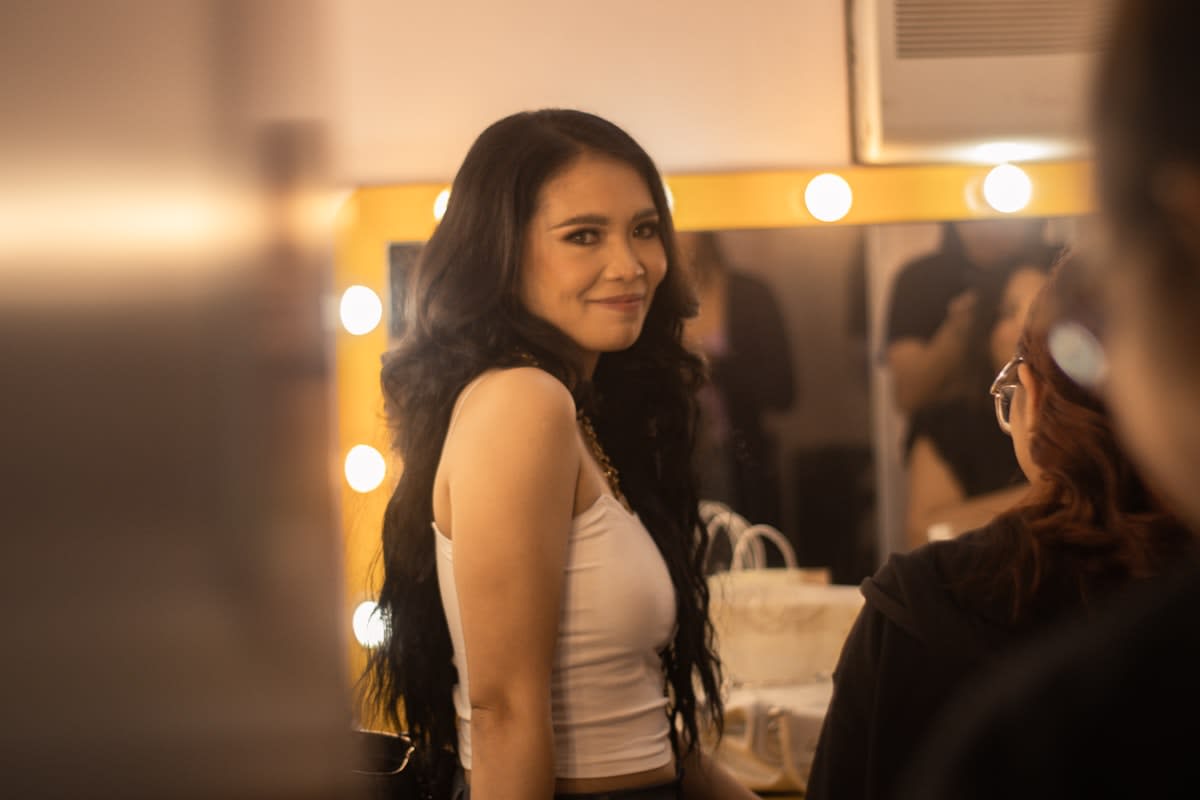 Person standing backstage before a big speech