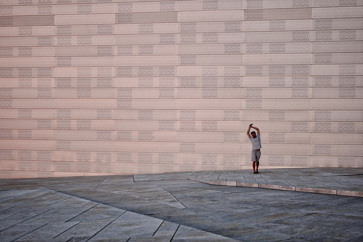 person meditating in a modern minimalist setting