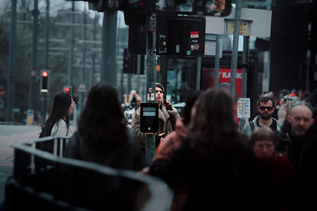 Person using a smartphone in a crowded city