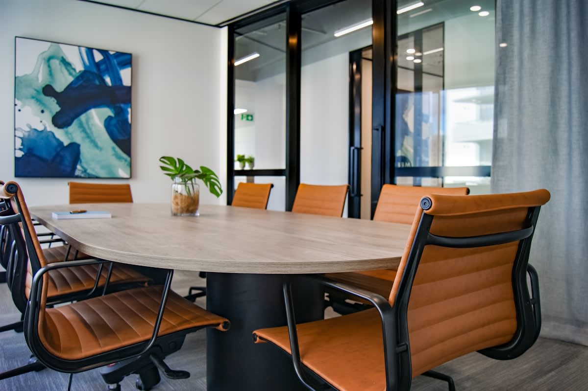 Modern office boardroom with diverse executives in a collaborative setting