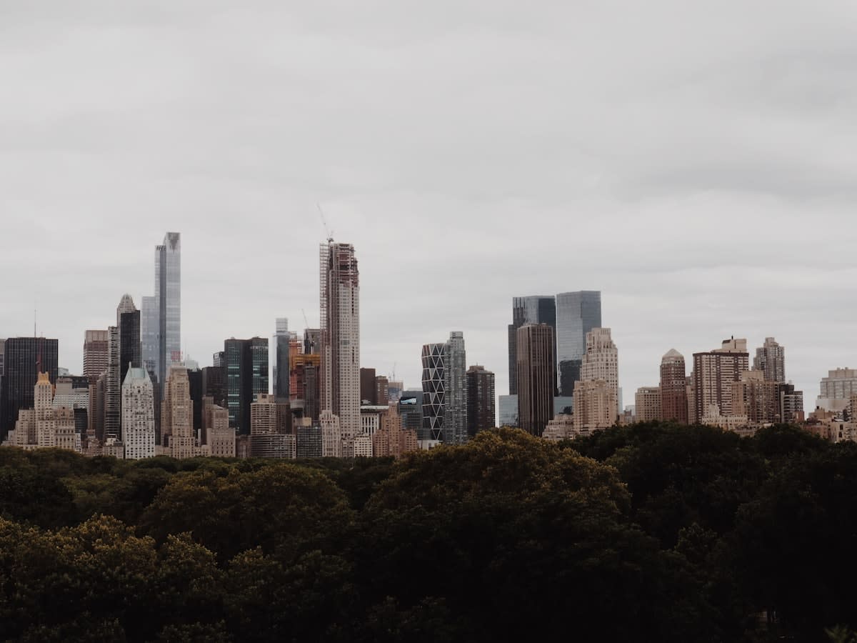 Modern mid-sized city skyline with green spaces