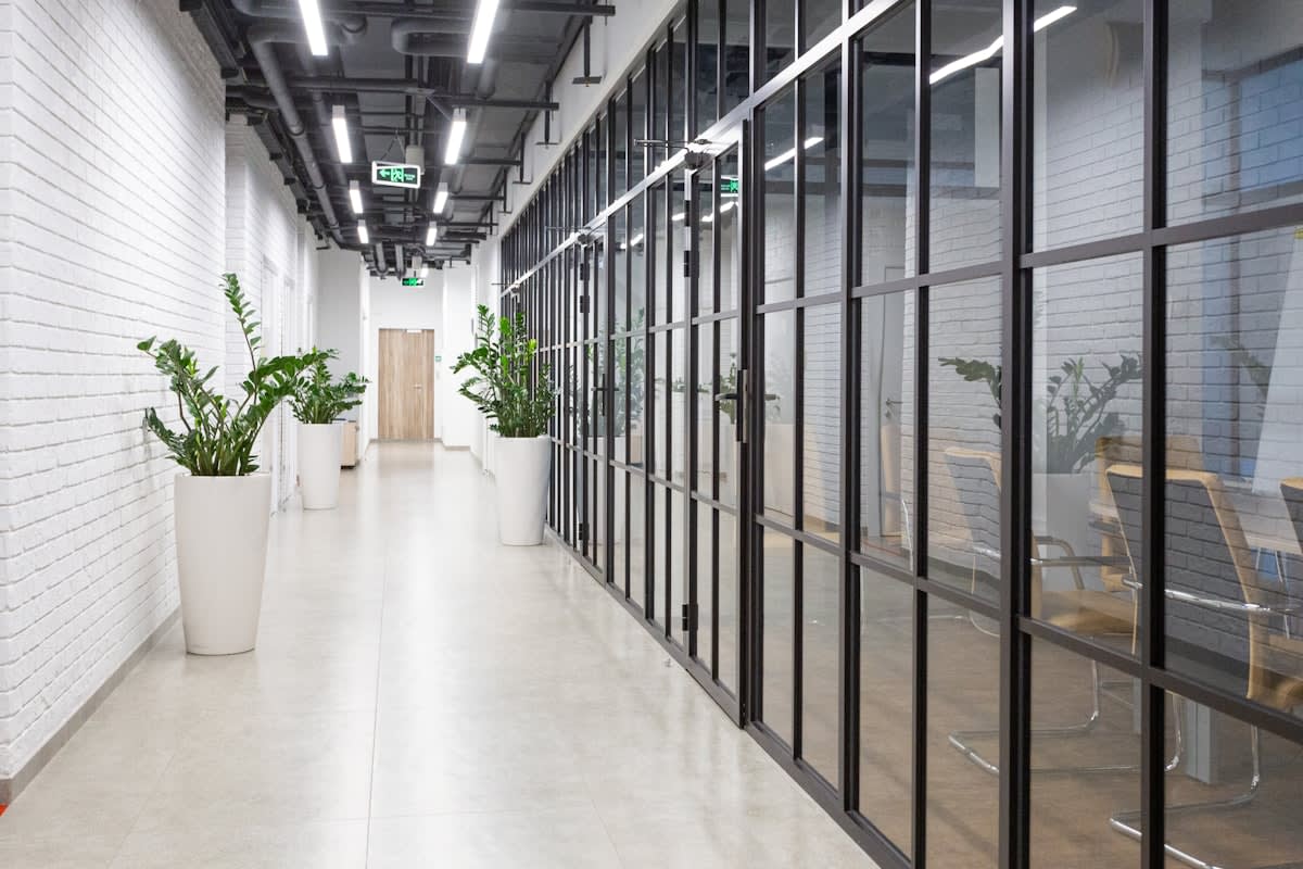 Minimalist modern office corridor with soft lighting