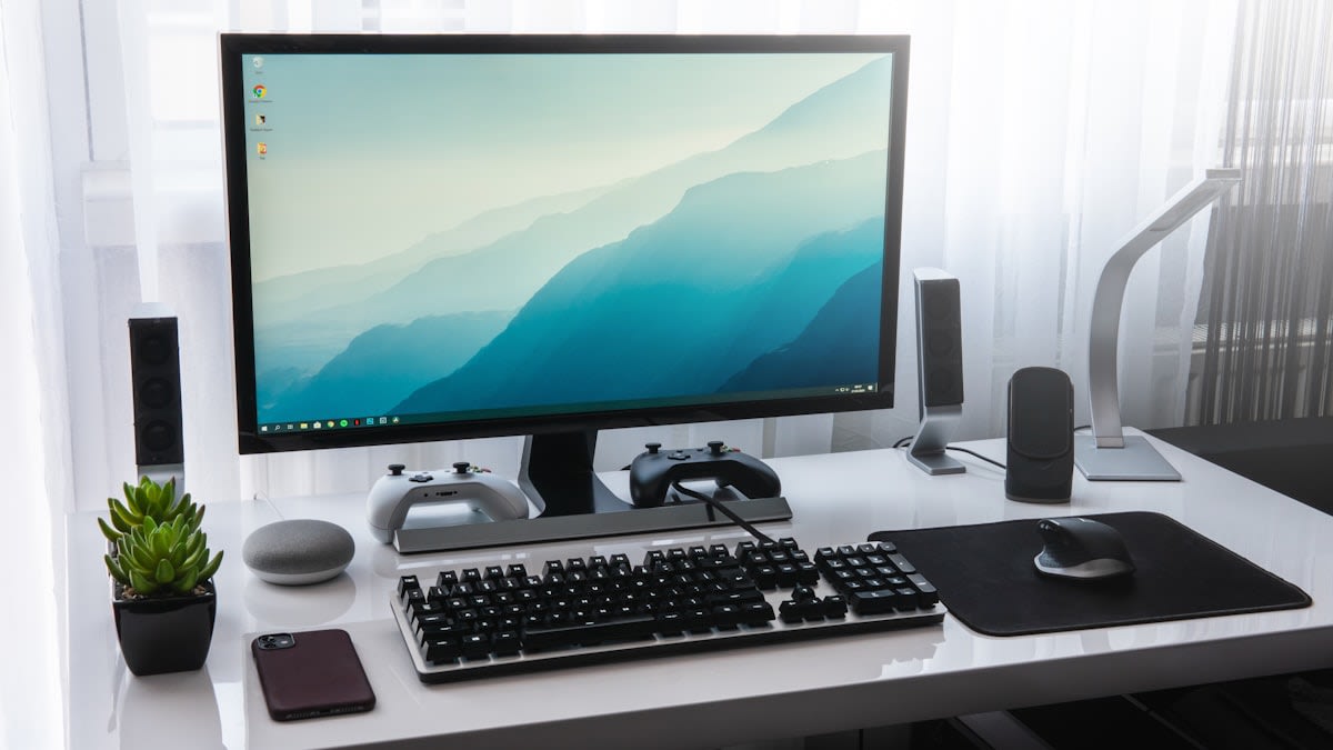 High-end computer setup with multiple monitors and clean desk