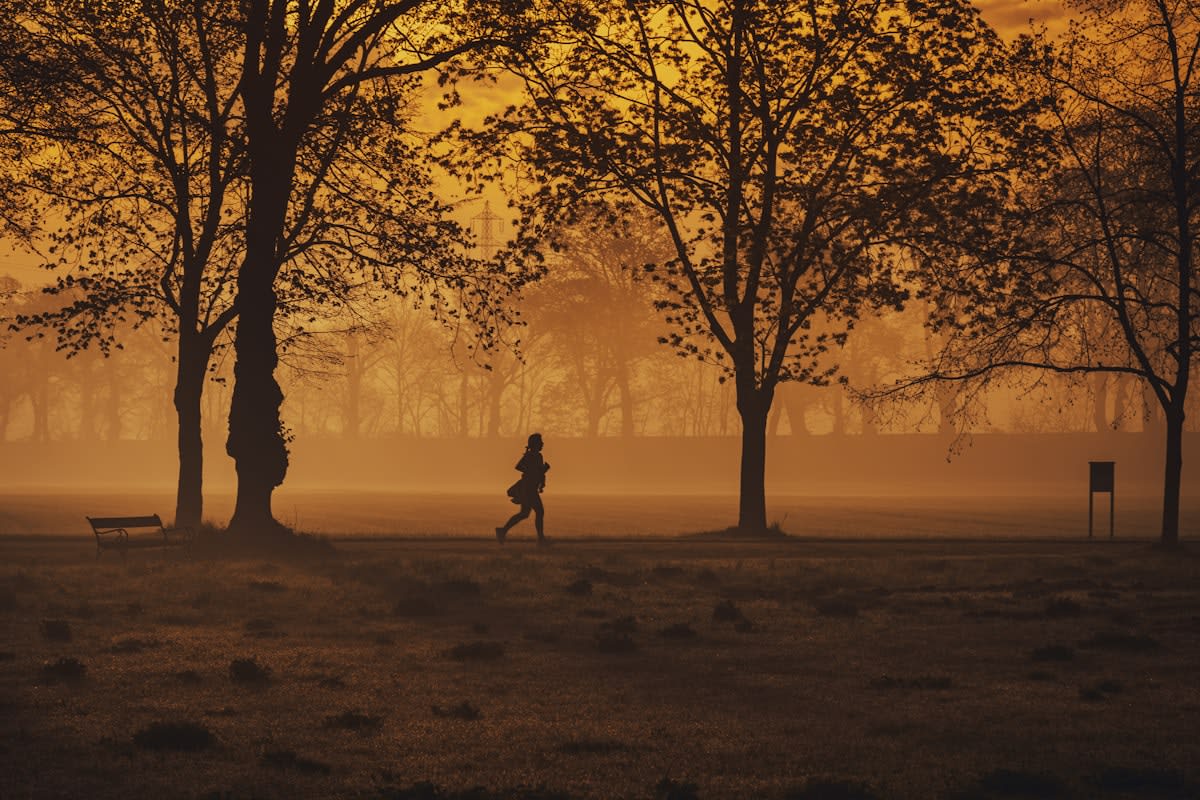 A woman jogging in a park with a translucent overlay of a glowing, connected neural network