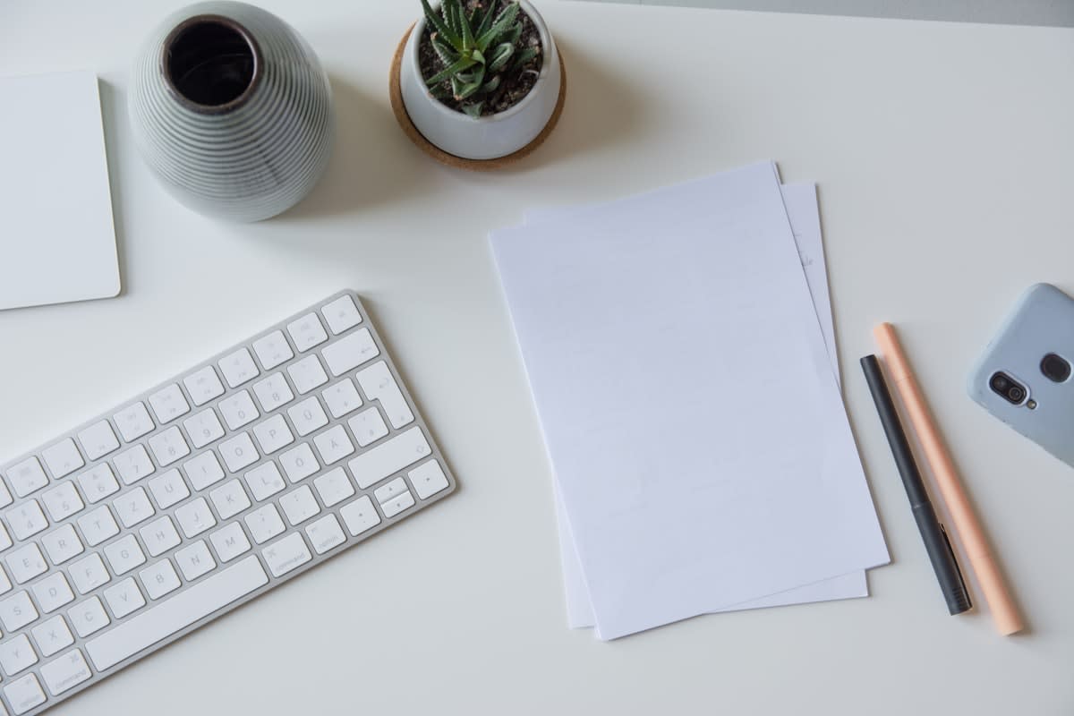 Organized desk with notebook and pen