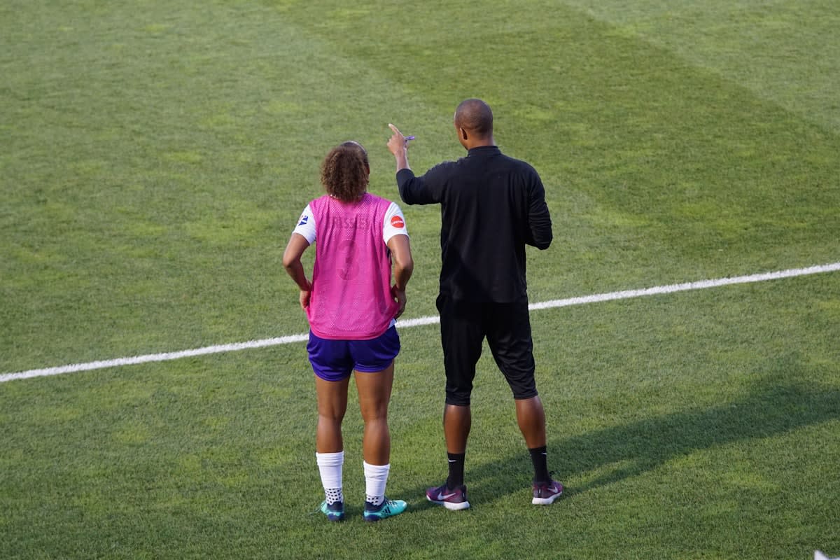 Coach talking to athlete