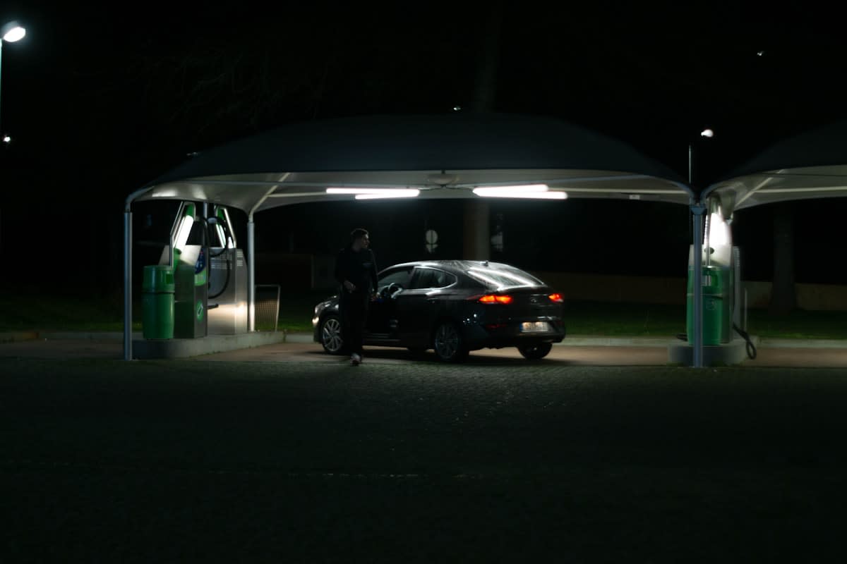 Electric vehicle charging station at night