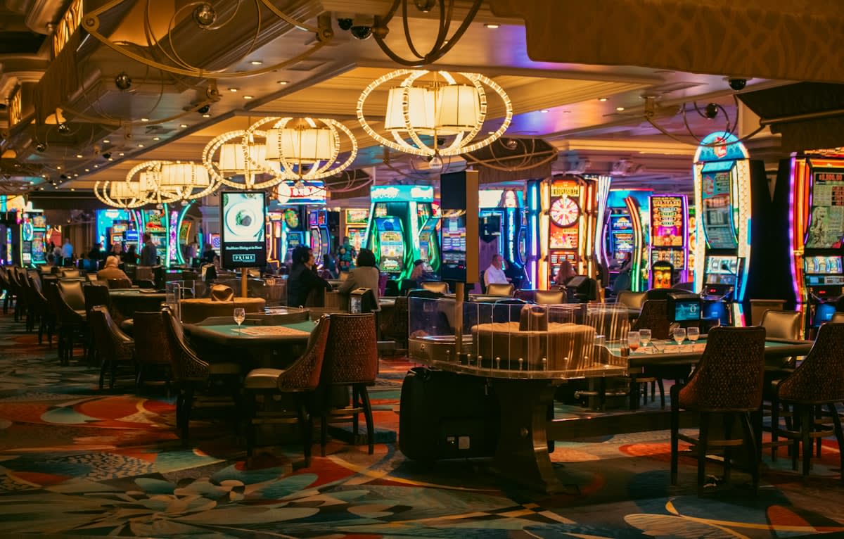 A bustling casino floor with blurred motion of people
