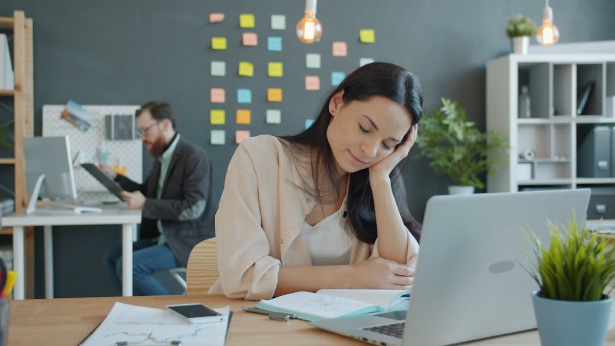 Overwhelmed executive in a modern office
