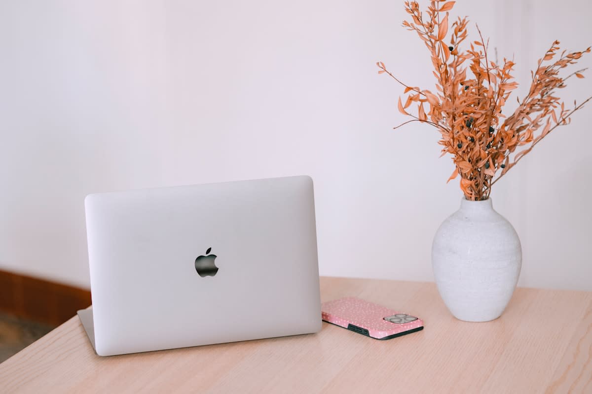 minimalist workspace with a laptop and a smartphone