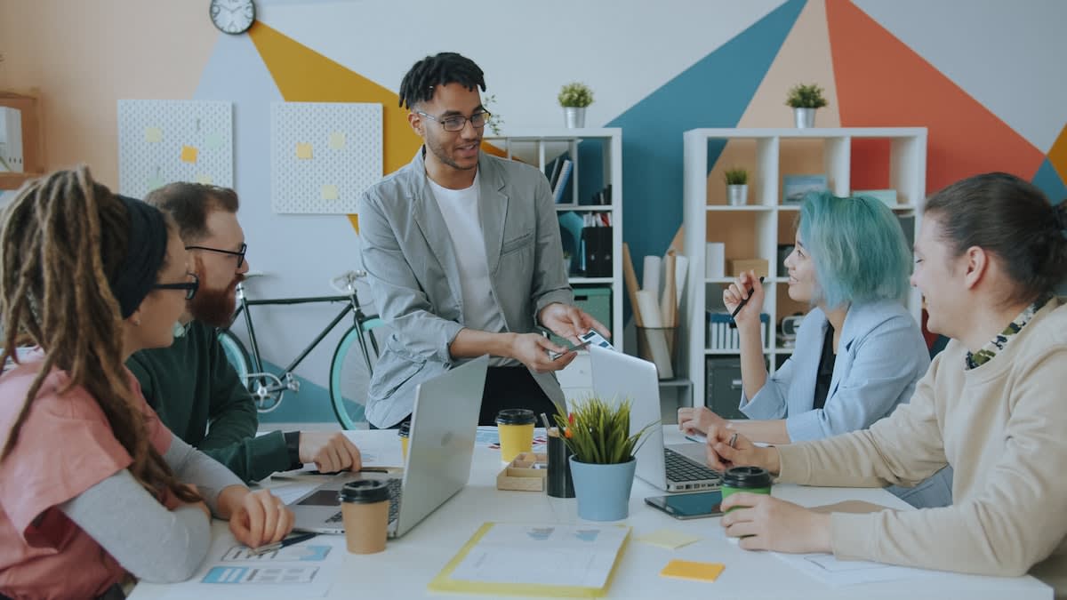 Diverse group of professionals in a modern meeting space