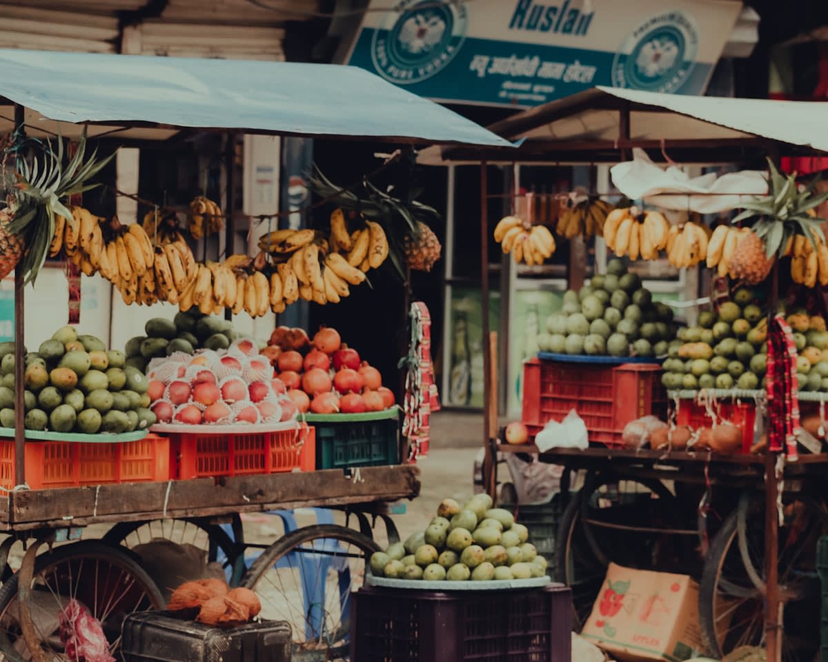 Colorful outdoor market stalls with fresh produce