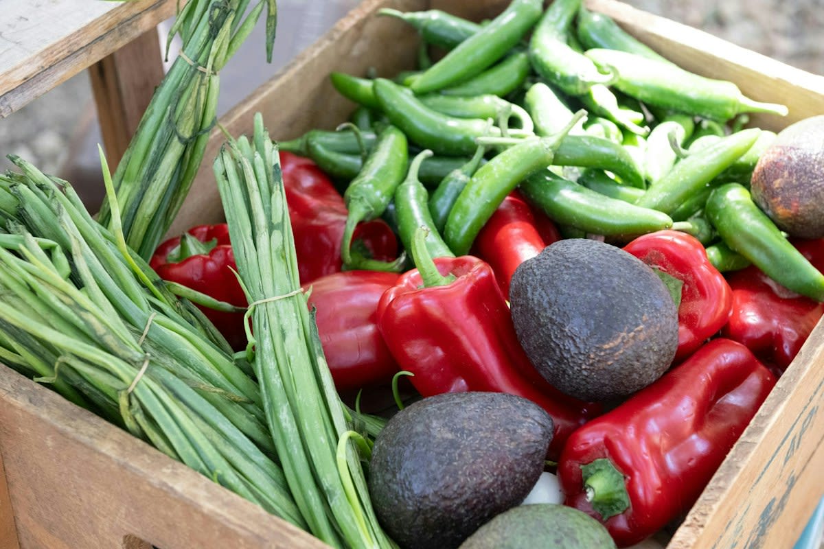 Close up of organic vegetables in a wooden crate