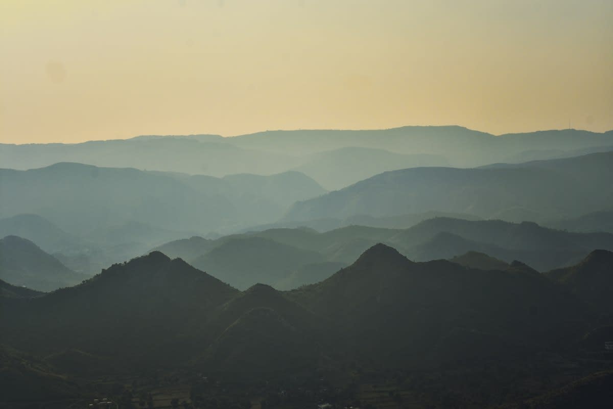Mountain range with distant construction