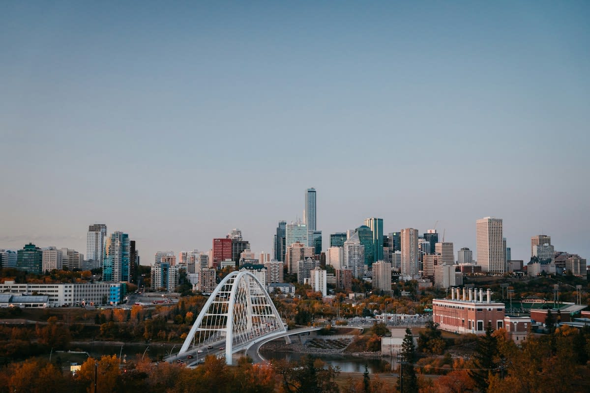 Modern mid-sized city skyline with green spaces