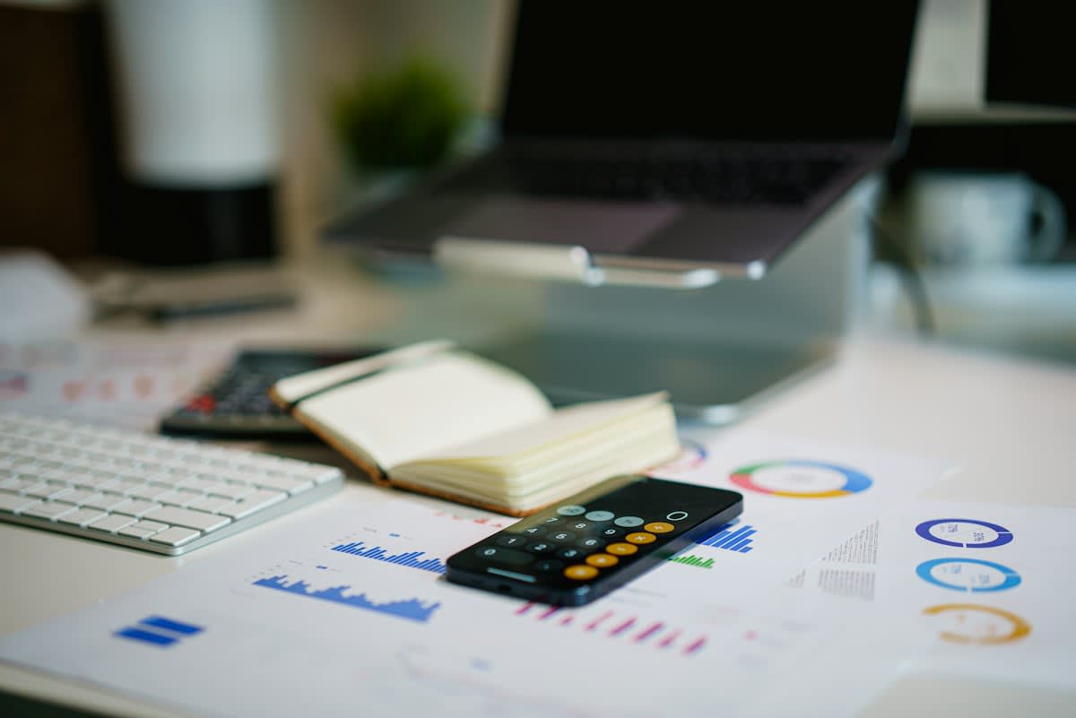 Financial documents and calculator on a desk