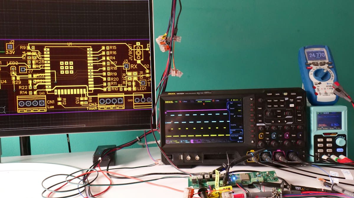 Hardware engineer debugging chip with oscilloscope