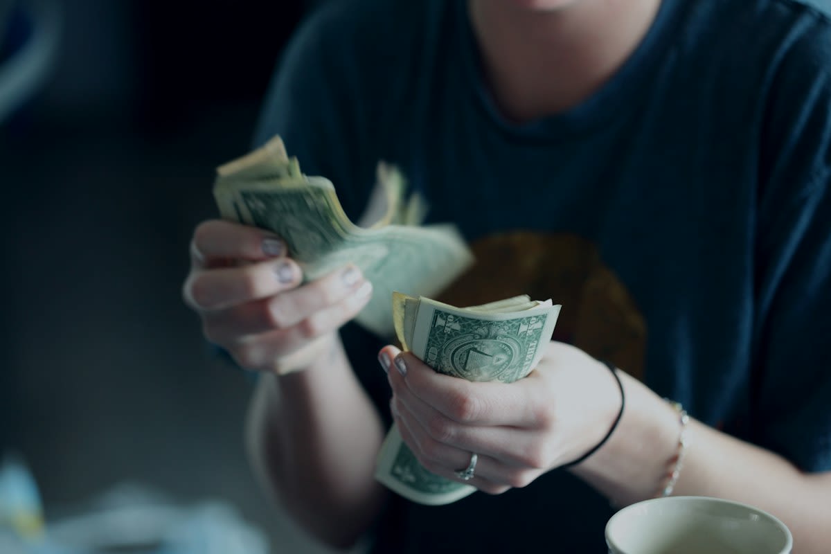 Close up of hands exchanging money