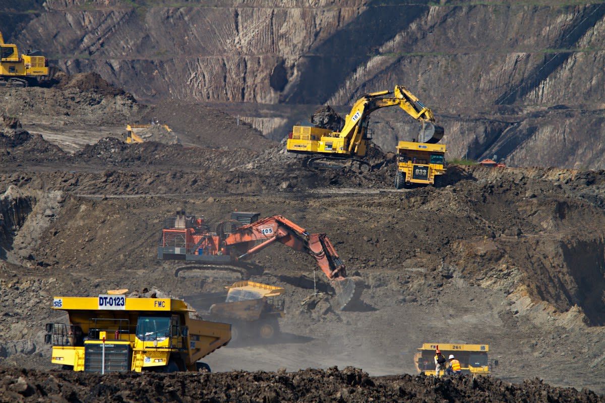 Industrial mining landscape with heavy machinery