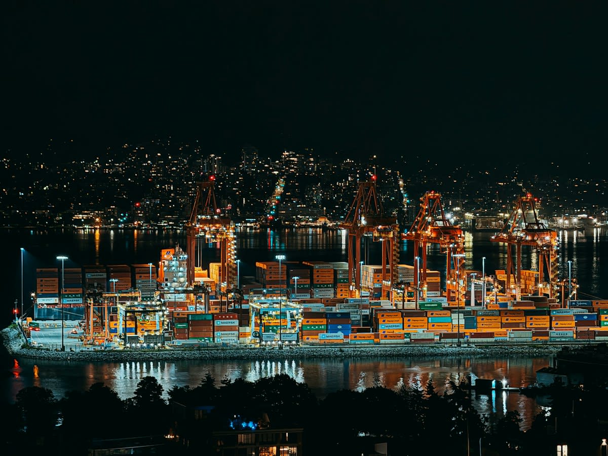 Industrial shipping containers at a busy port