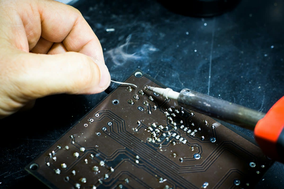 Close up of circuit boards and soldering iron in a workshop