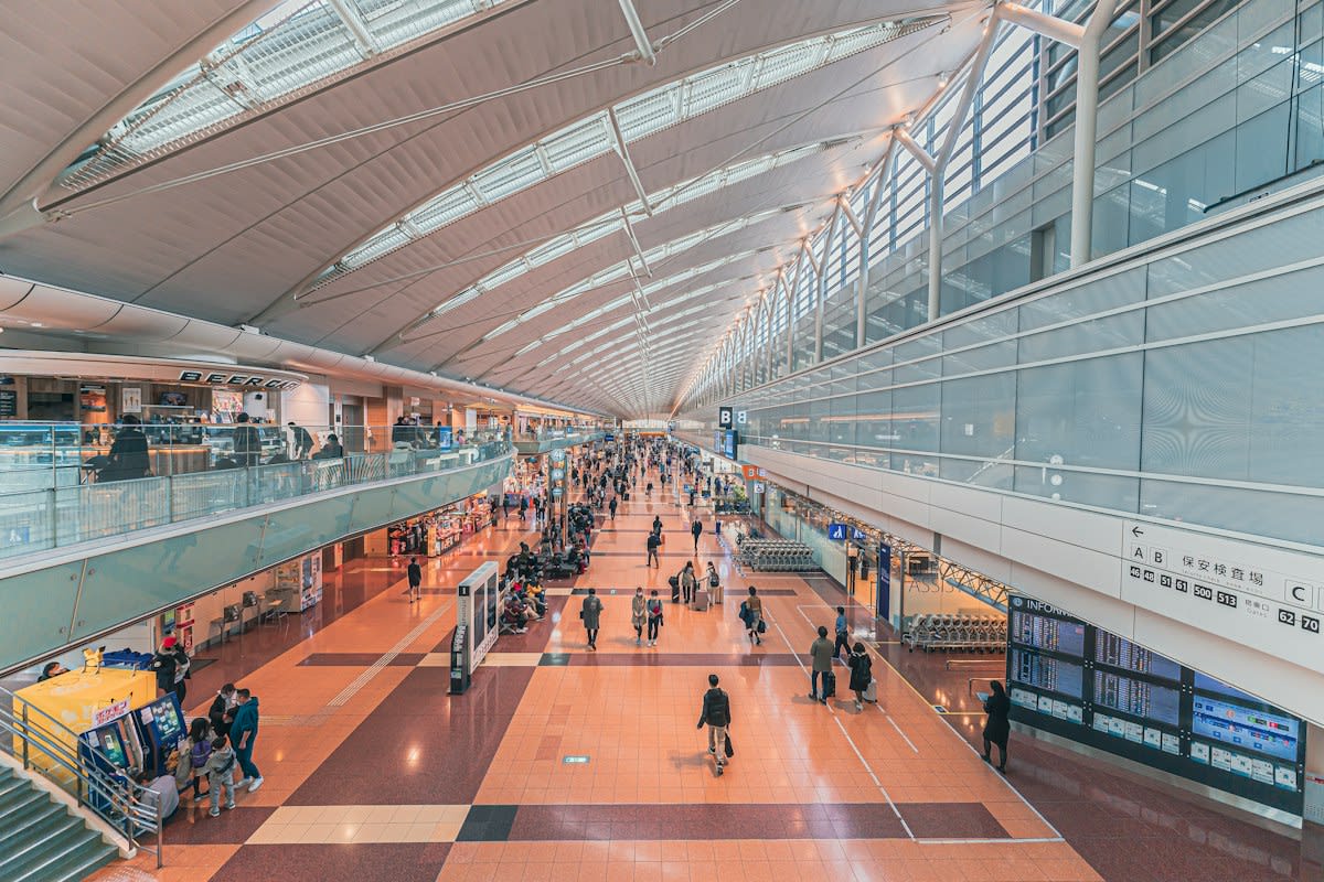 Modern airport terminal interior with high ceilings and luxury lighting