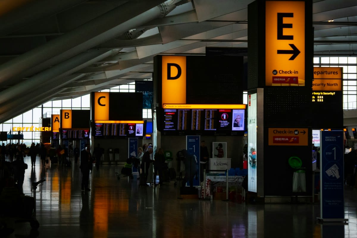 Close up of airport signage and blurred retail background