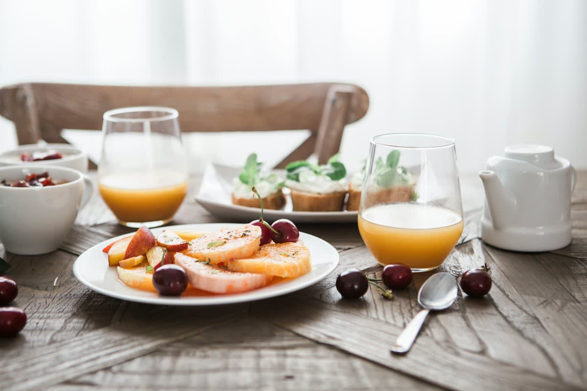 Corporate breakfast buffet with pastries and juice
