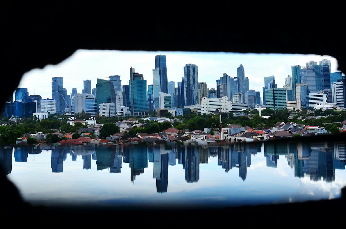 Jakarta flooded streets with residents wading through water
