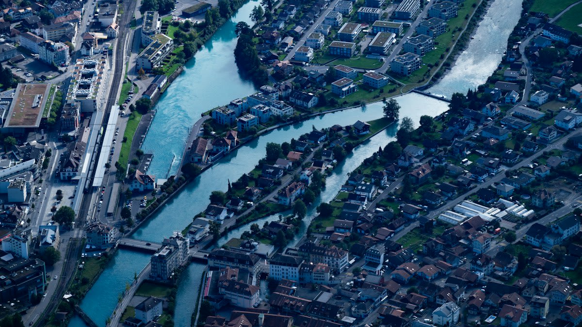 Aerial view of floating structures in an urban waterway