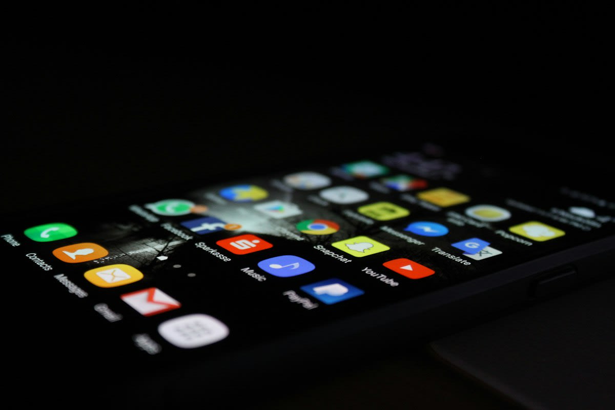 Close up of a smartphone screen showing a diverse user interface