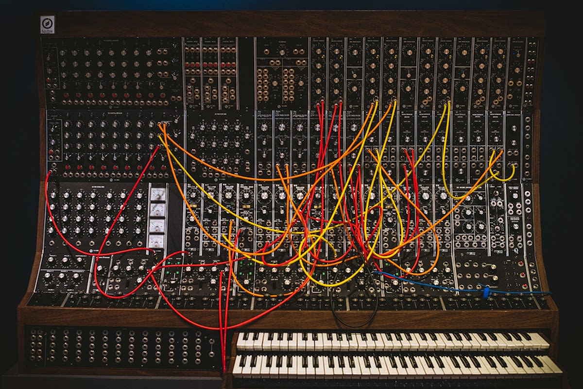 analog synthesizer knobs and cables