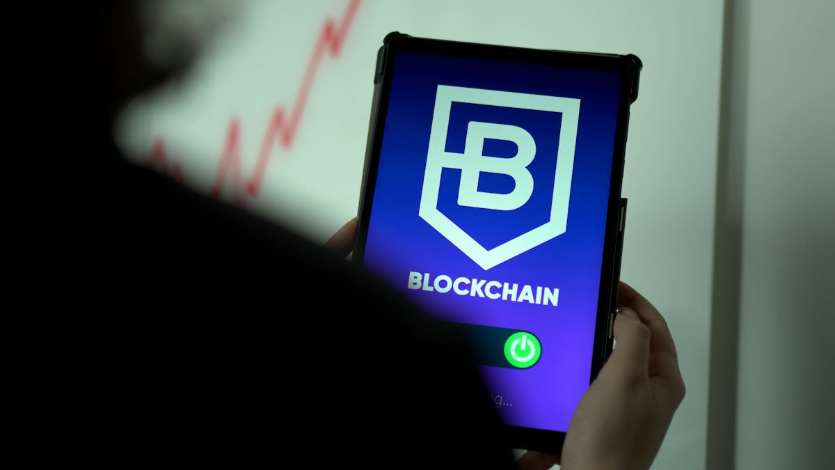 Close up of a digital tablet showing a blockchain transaction ledger
