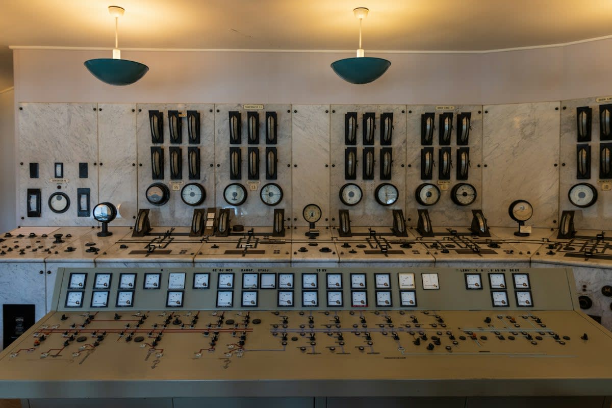 Industrial control room with multiple screens