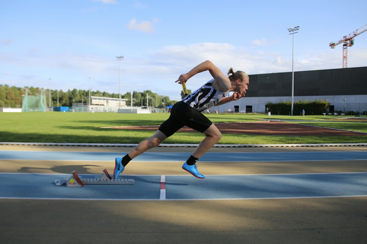 Close up of a track athlete's legs at the starting block