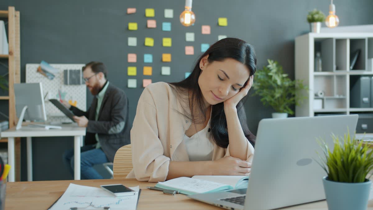 Close up of a stressed professional in a modern office