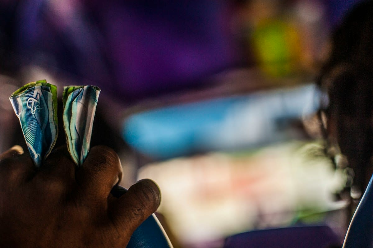 close up of hands counting cash