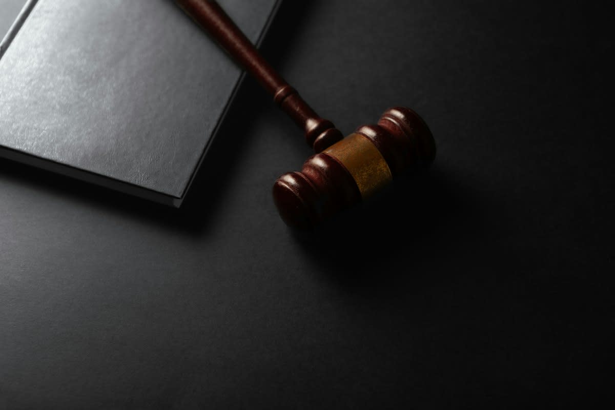Close up of a legal gavel and official documents