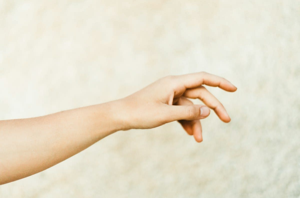 close up of human hands barely touching