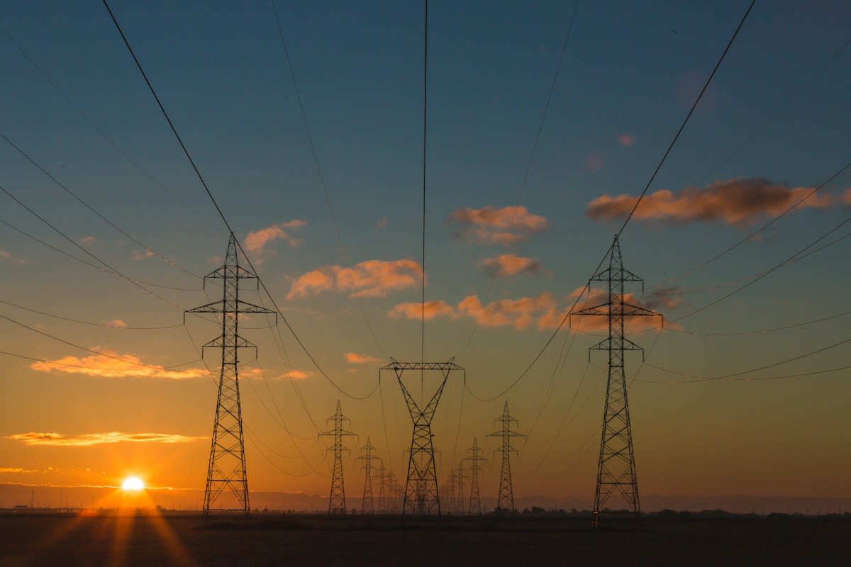 High voltage power lines crossing a landscape