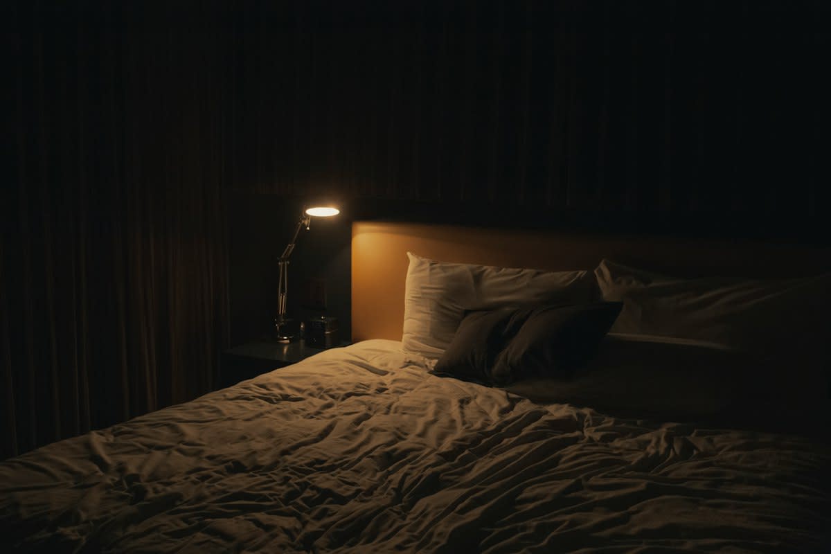 Dark bedroom with a single light source