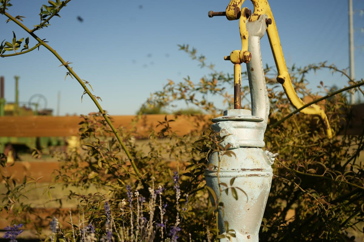 Old water pump in a field
