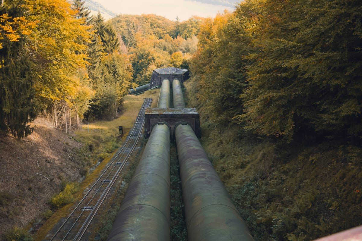 Industrial geothermal pipes with rust and steam