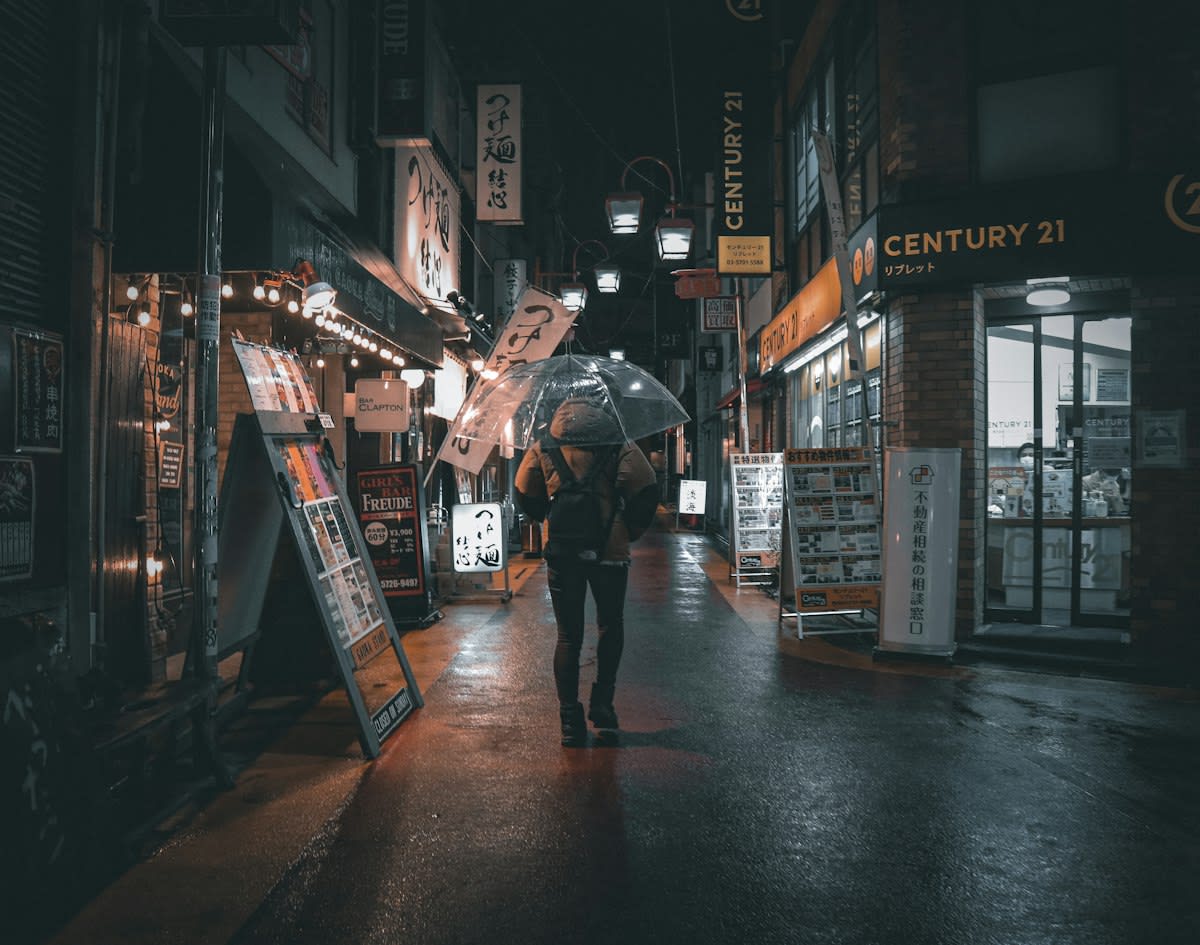 Rainy Tokyo alleyway with vending machines