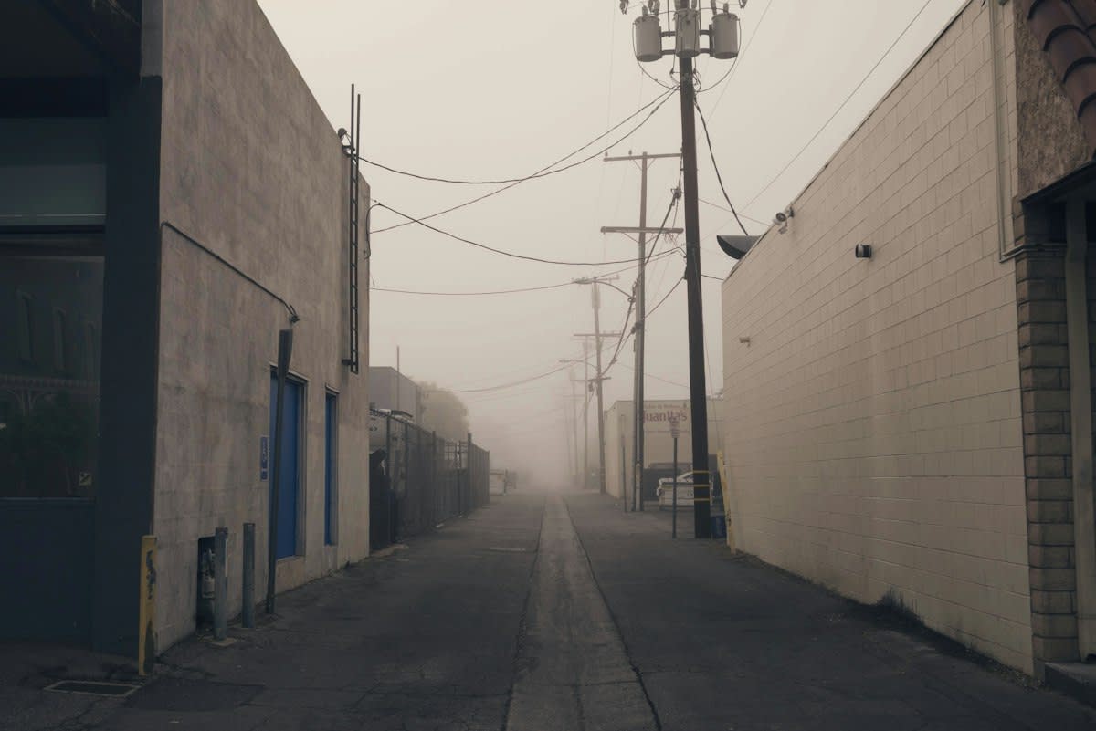 Dense urban alleyway with mixed materials