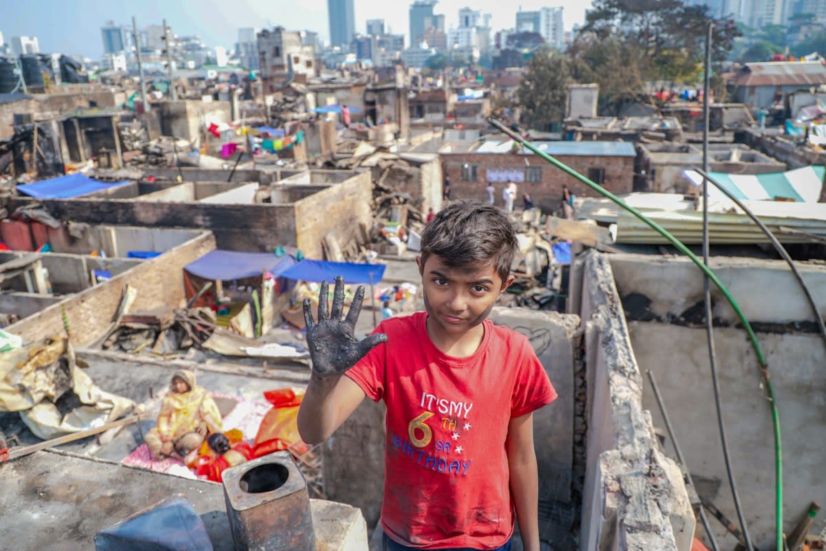 Runner in a crowded urban slum environment