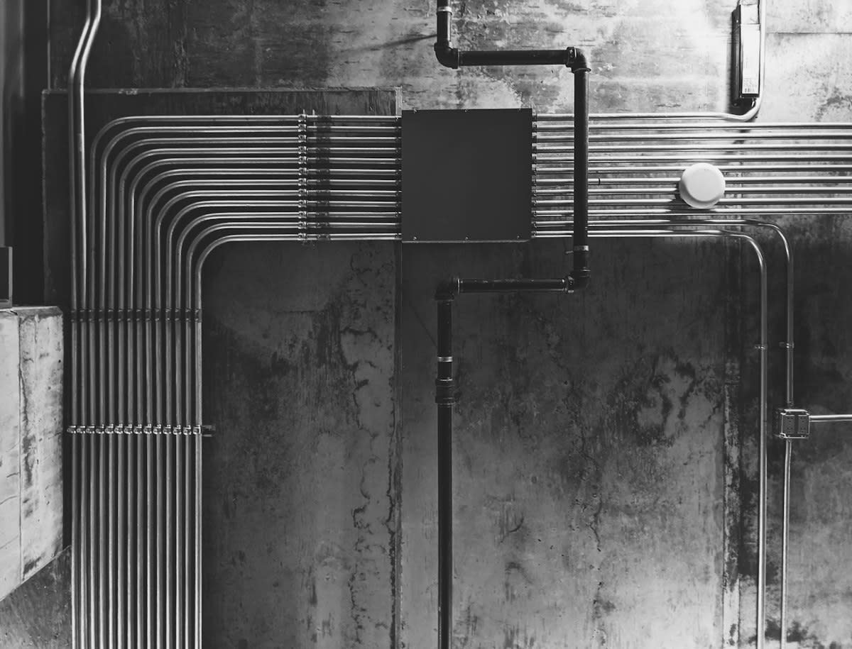 corroded industrial pipes and wires