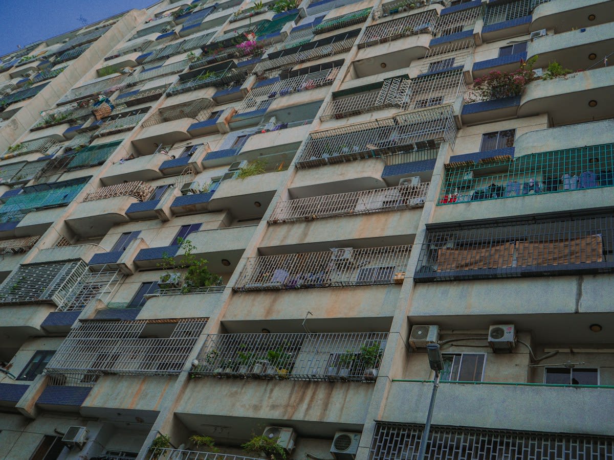 dense concrete apartment blocks in a southeast asian city